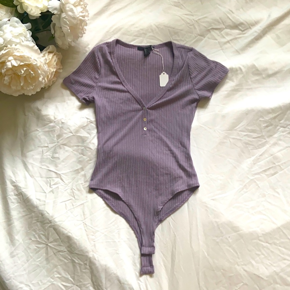 adorable lavender bodysuit with button detailing and breathable bodycon fabric